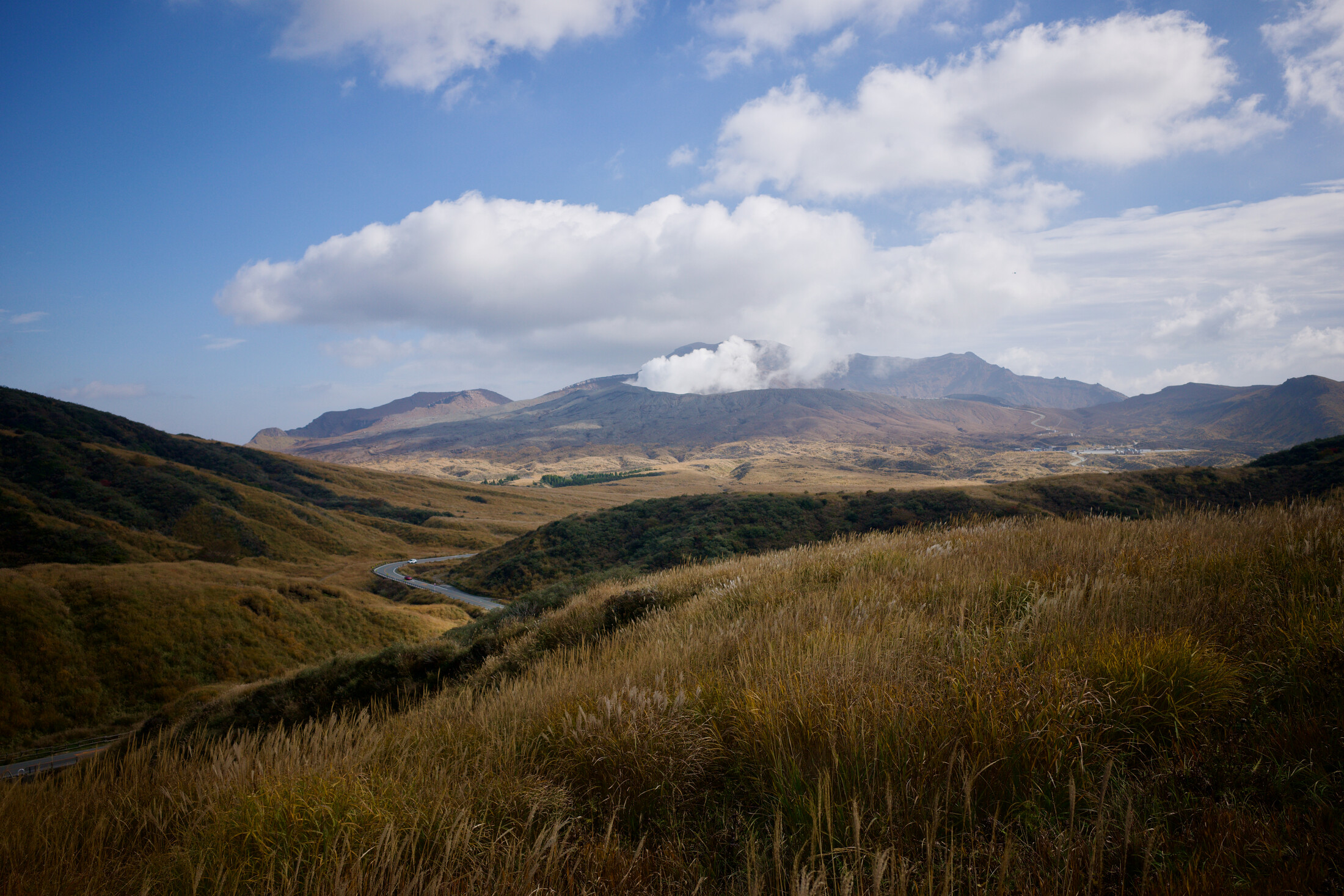 Mountains around Mt Aso, with smoke from the crator