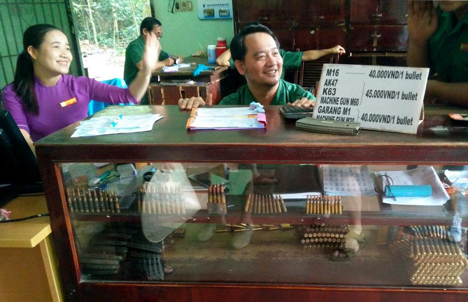 Smiling while selling bullets