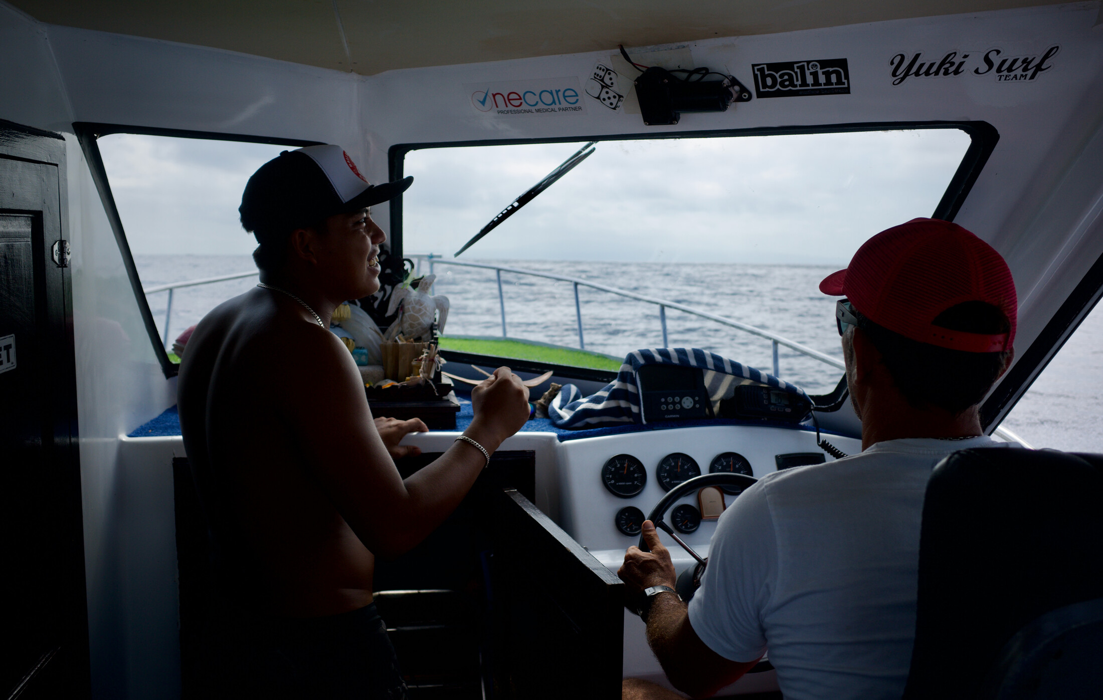 A shipper and crewmate on a boat to Nusa Lembongan