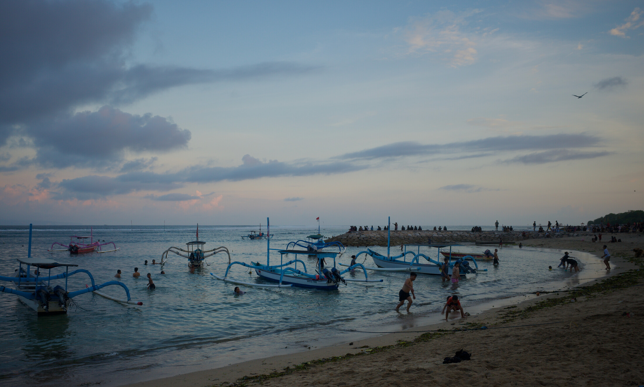 Locals swimming in Sanur beach after work